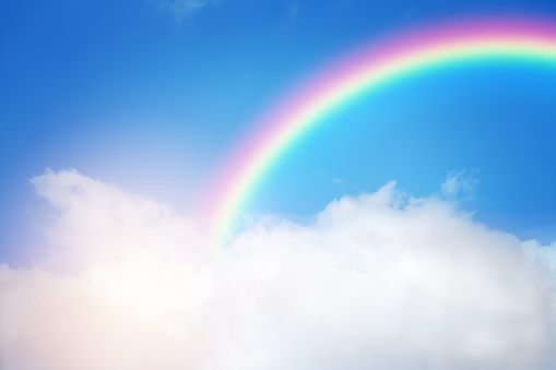 rainbow-in-cloudy-sky-picture-id1208976206