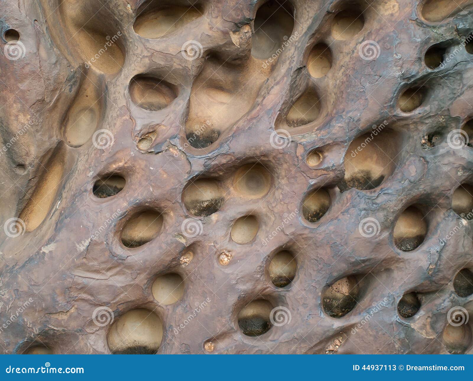 stones-holes-caused-water-erosion-44937113.jpg