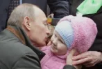 2011-01-03-12-27-26-10-russian-prime-minister-vladimir-putin-kissed-a-bab.jpeg.w300h205.webp