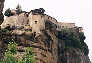 320px-Large_monastery_situated_high_on_mountain_Greece.jpg